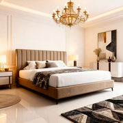 Luxurious bedroom with a large bed, chandelier, and decorative elements.