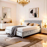 Luxurious bedroom with a bed, chandelier, and decorative elements.