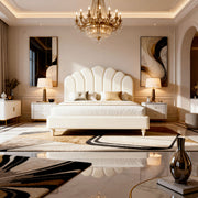 Luxurious bedroom with a large bed, chandelier, and decorative elements.